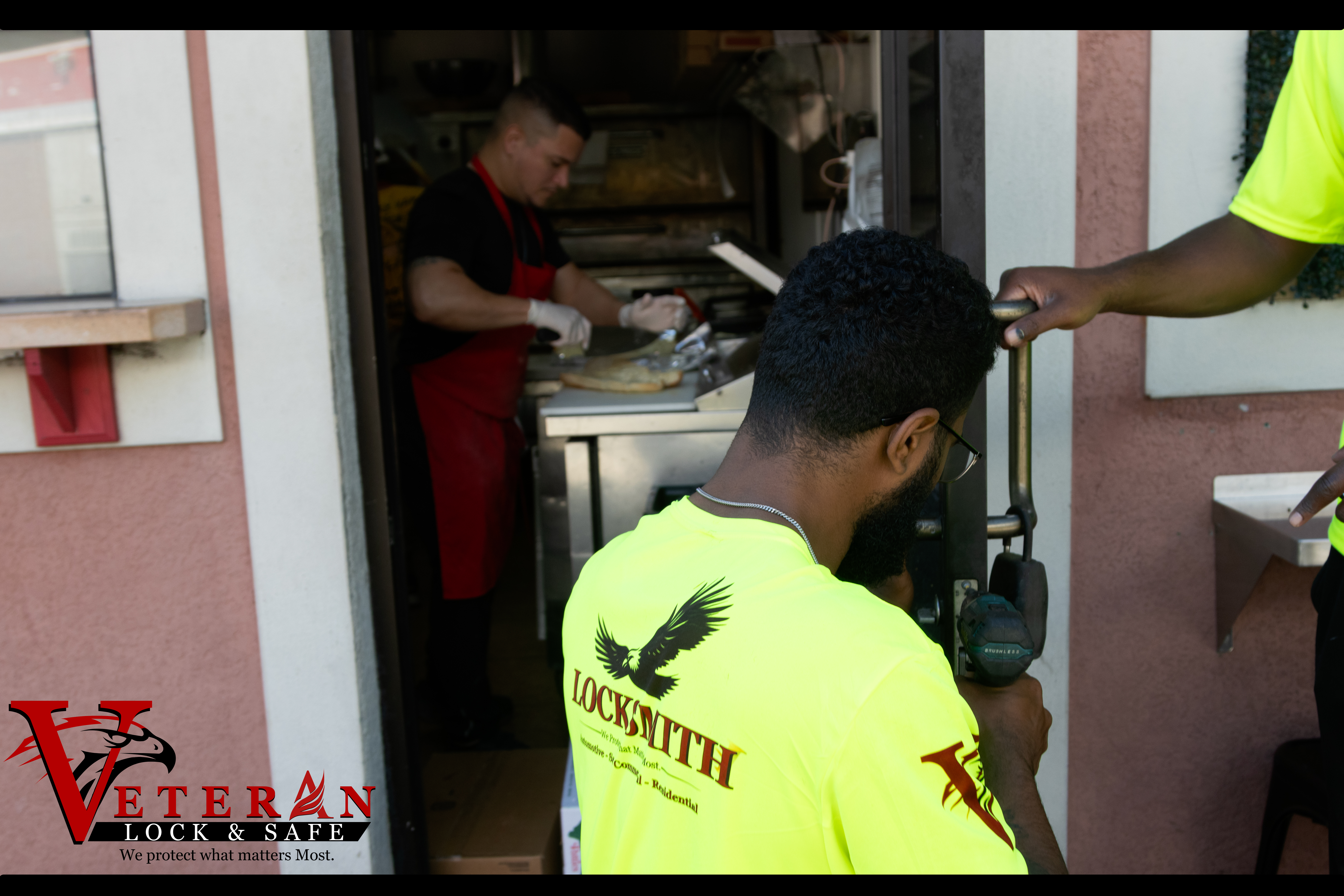 Locksmith technicians working at a commercial service call